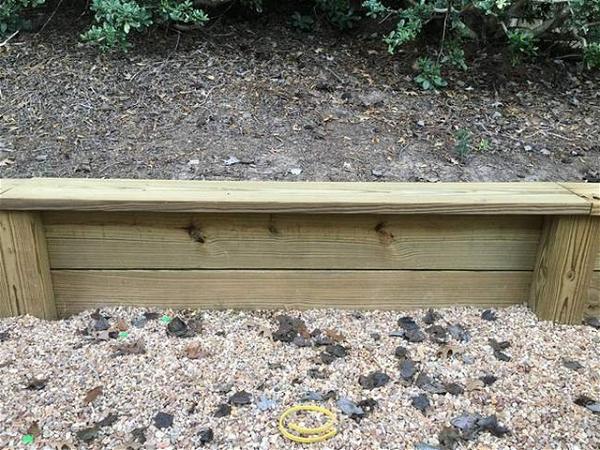 DIY Outdoor Wooden Retaining Wall