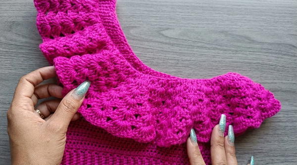 Crocheted girl's blouse with a flared 6